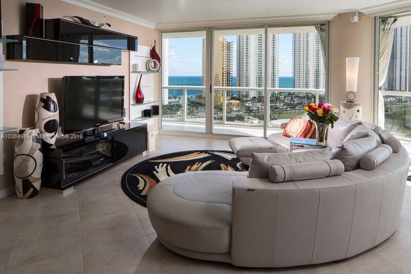 Spacious Living room with gorgeous view...and all electric window shades