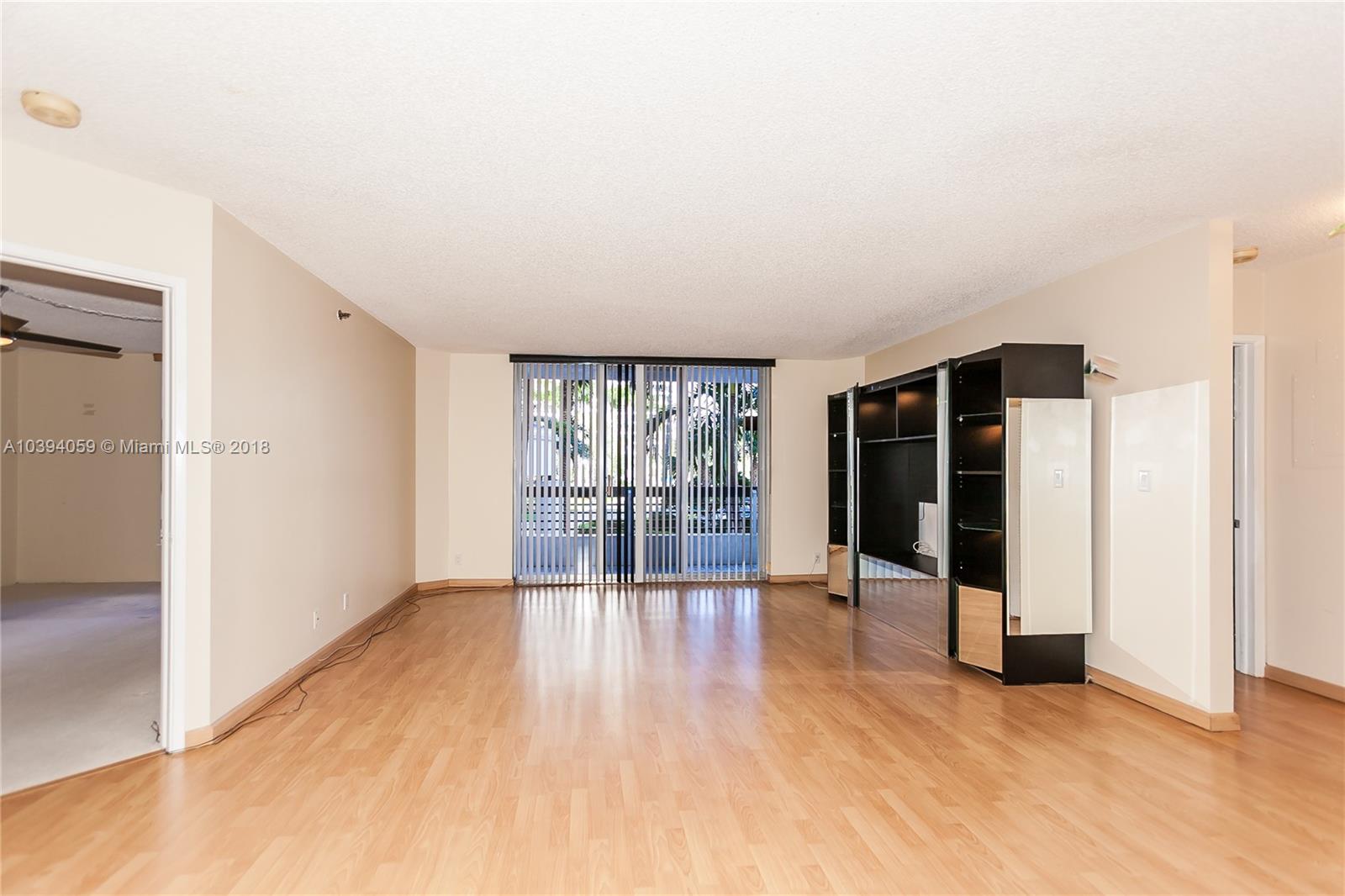 Beautiful laminated floors and spacious living room.