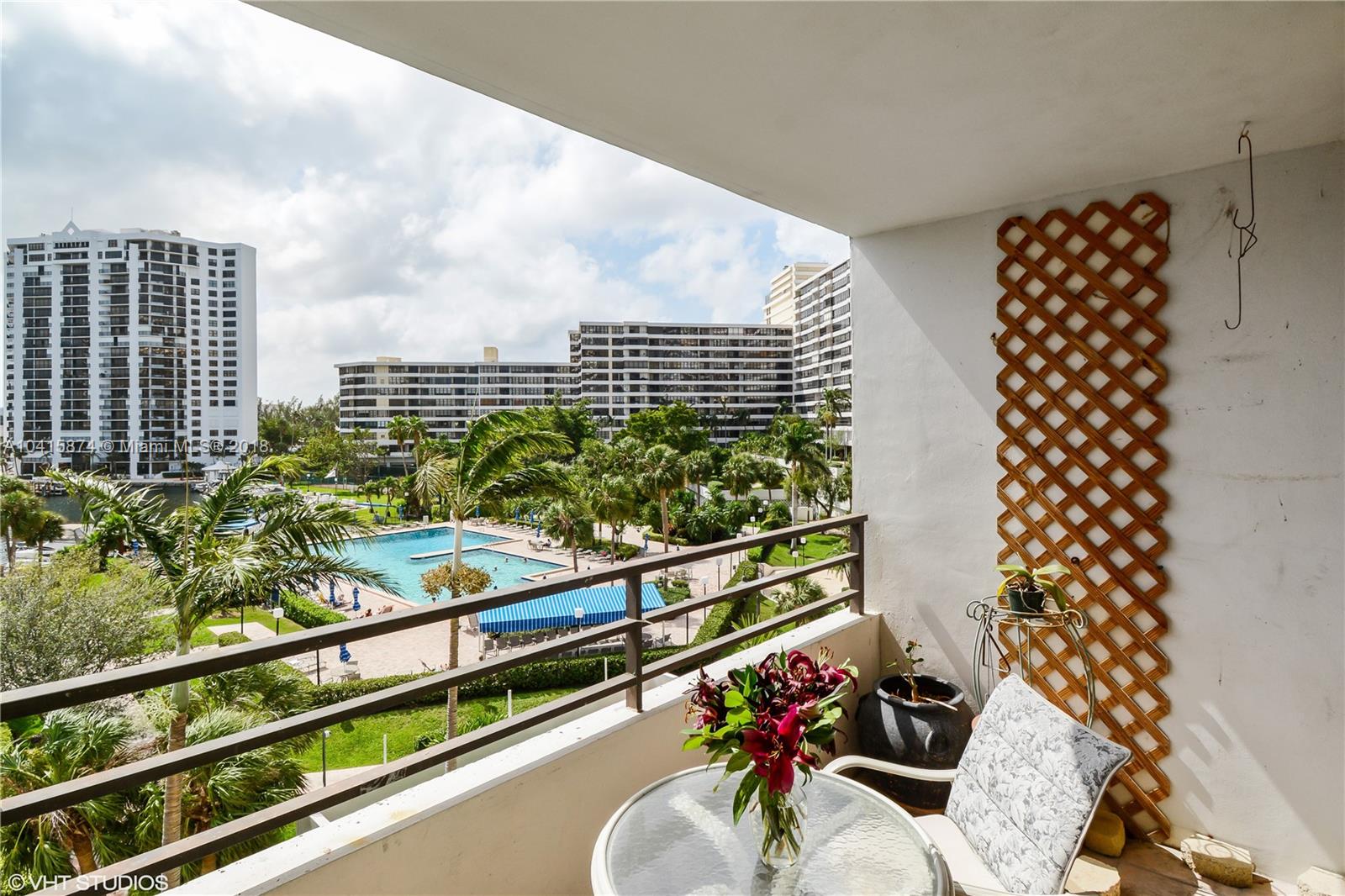 View from balcony includes tennis and marina as well as pool and recreation center.