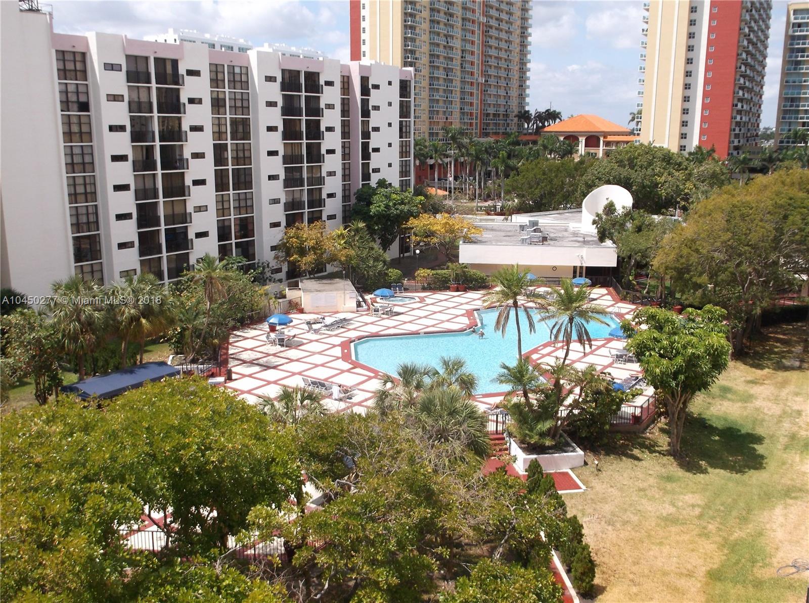 ACTUAL VIEW FROM UNIT, OF POOL AND GARDEN AREA, NOT ENHANCED