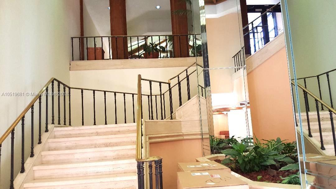 LOBBY STAIR CASE TO POOL DECK