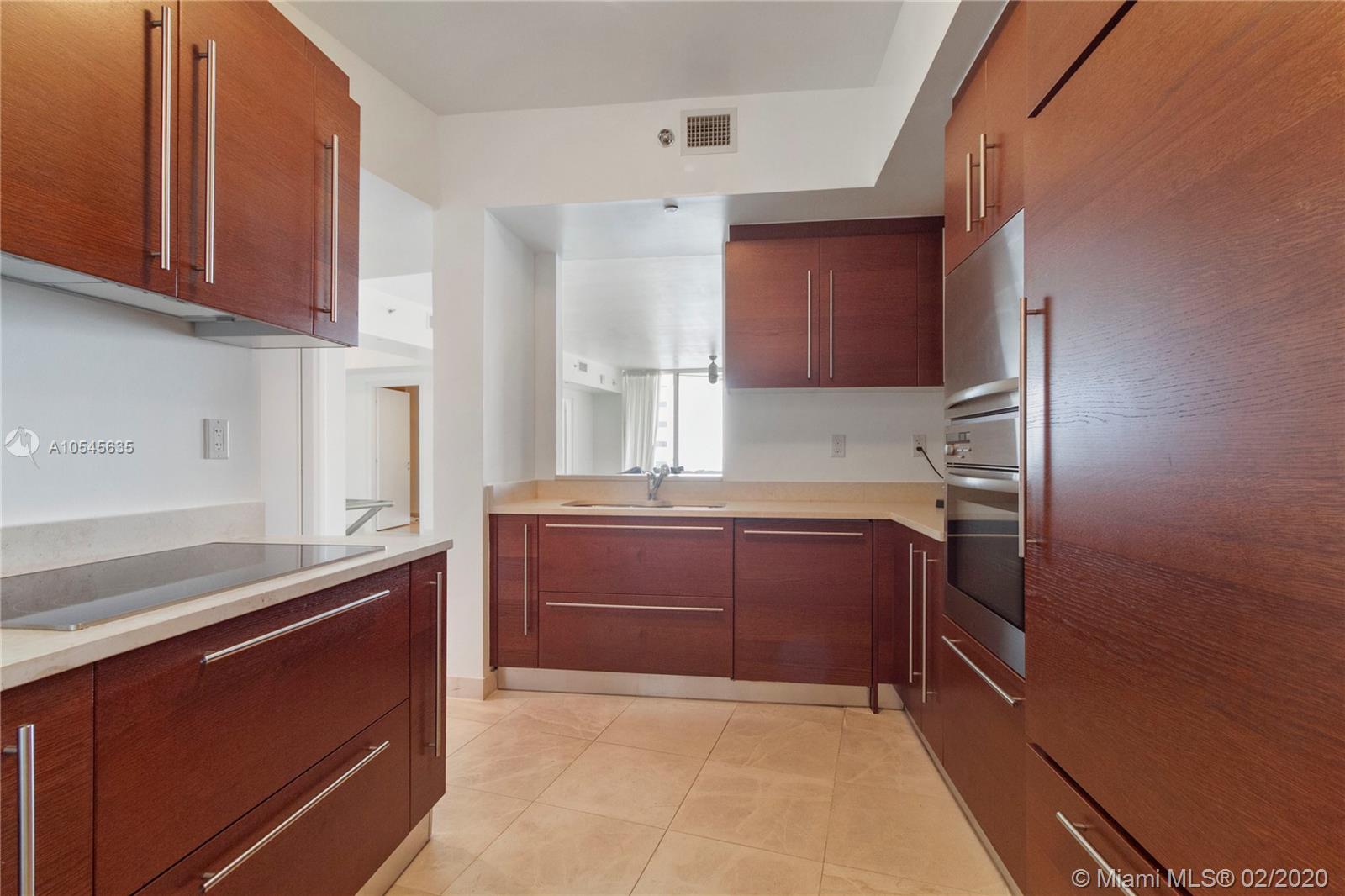 Photo of 450 Alton Rd #2305, Miami Beach, Florida, 33139 - Lobby, Half Bathroom, and Den (Convertible 3 bedroom)