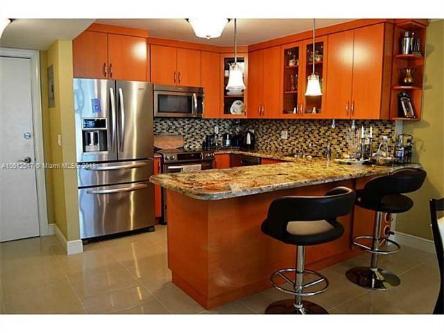 OPEN KITCHEN W/ SS APPLIANCES AND GRANITE COUNTERTOPS