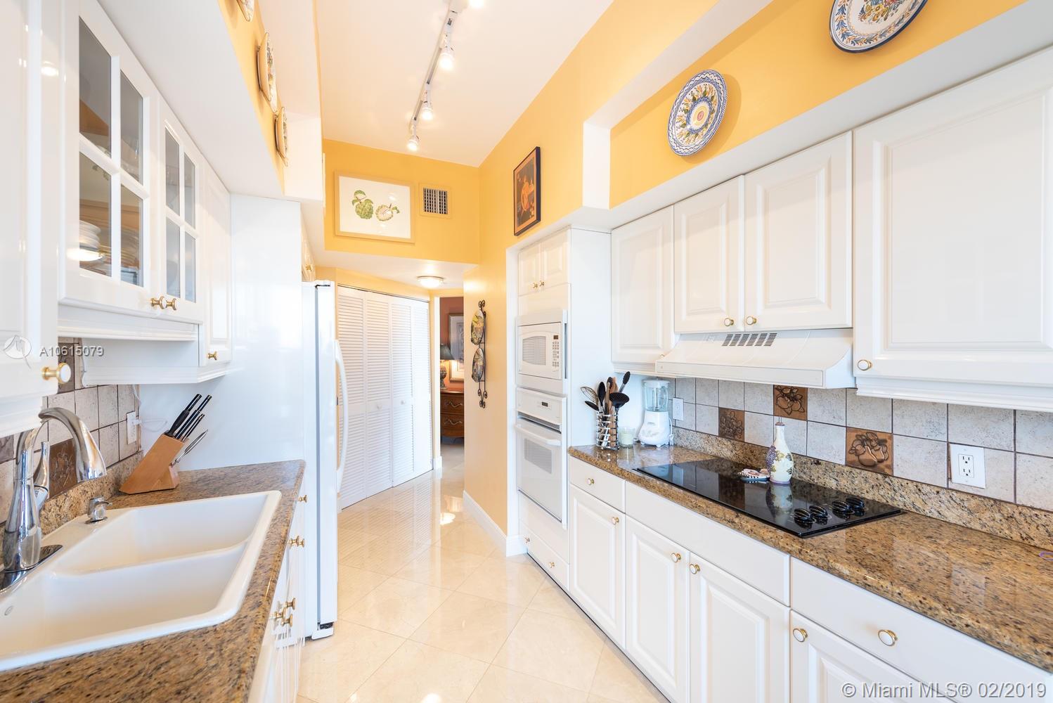 Photo of 8925 Collins Ave #11G, Surfside, Florida, 33154 - Living/dining room looking towards the foyer.