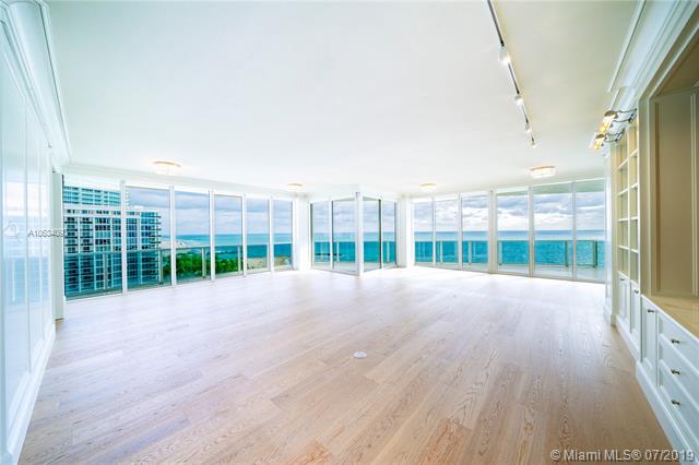 Photo of 10225 Collins Ave #901, Bal Harbour, Florida, 33154 - Expansive living and dining rooms featuring 10+ ft ceilings, Canadian hard-wood floors, custom build outs, built-in bar, paneled walls and unobstructed ocean views.