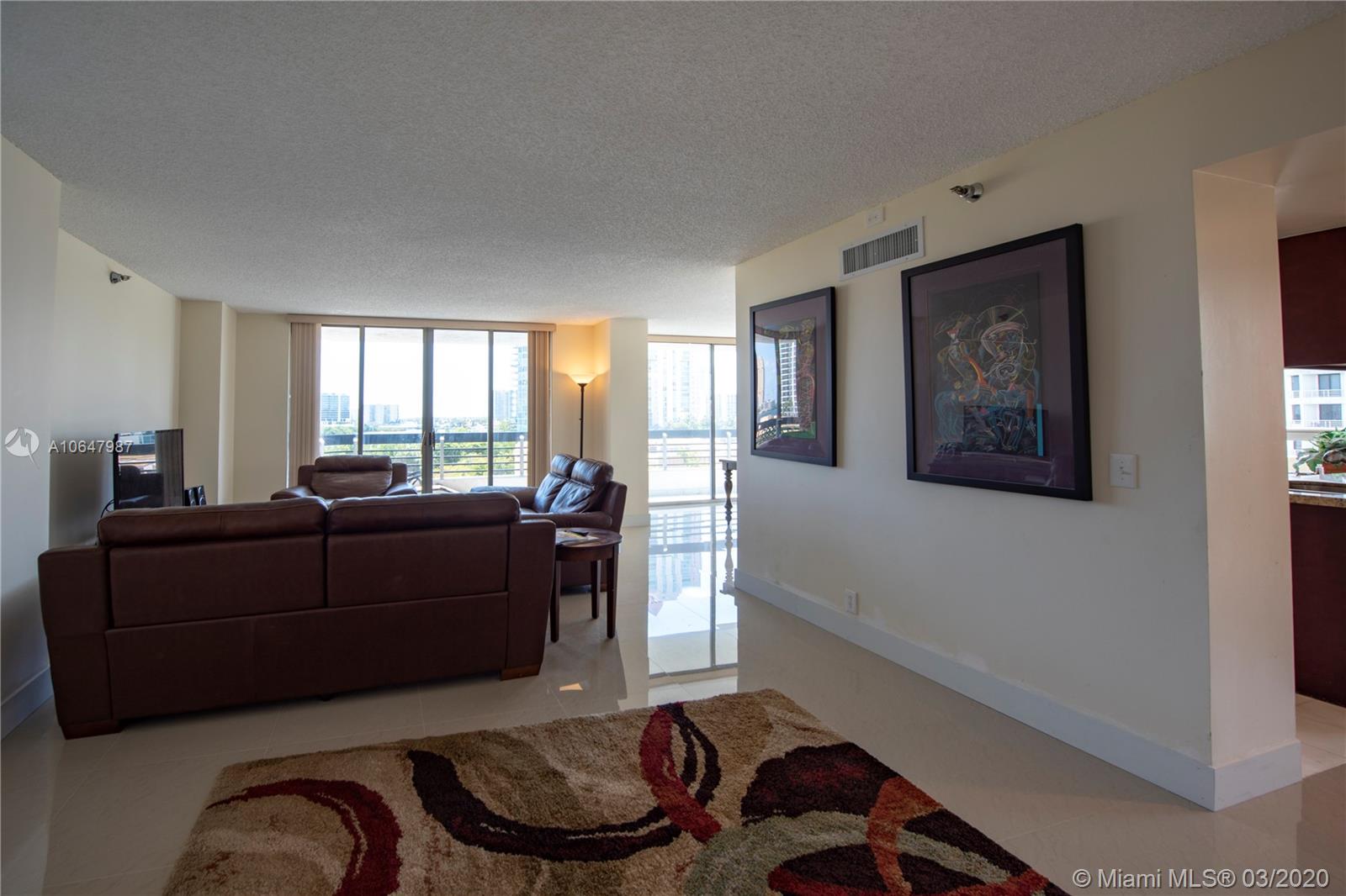 Photo of 3400 192nd St #704, Aventura, Florida, 33180 - Very spacious living room. Exquisite brand new porcelain tile floors.