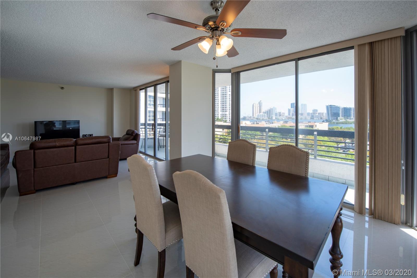 Photo of 3400 192nd St #704, Aventura, Florida, 33180 - Picture taken from the den into the living room.