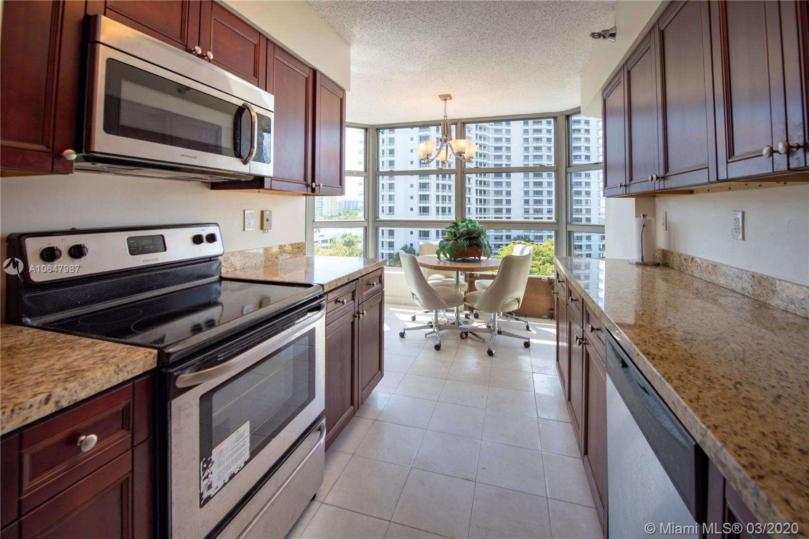 Photo of 3400 192nd St #704, Aventura, Florida, 33180 - Formal dining overlooking the intracoastal and Sunny Isles on the background.