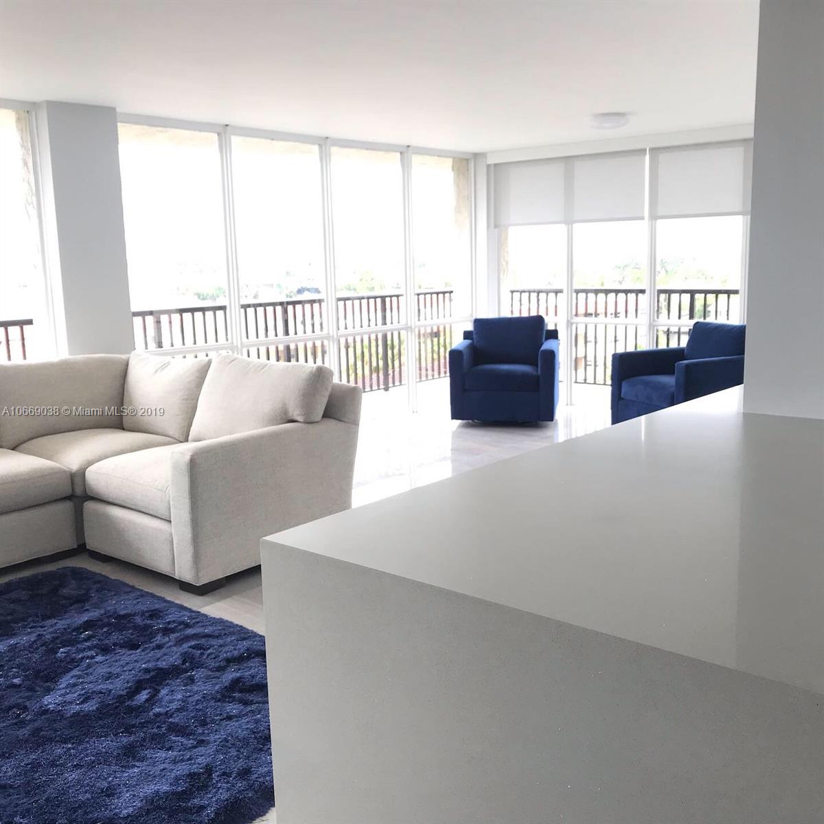 Renovated open concept living room, dining room and Kitchen