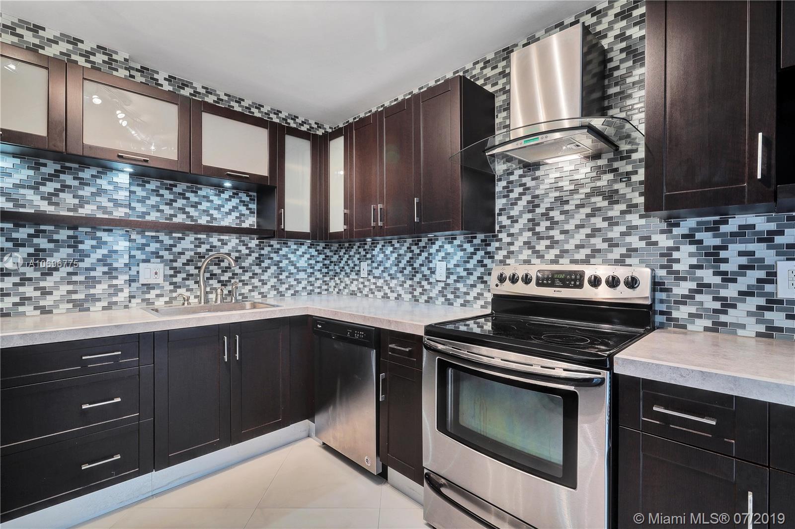 Photo of 1500 Ocean Dr #11 J, Hollywood, Florida, 33019 - Stunning glass tile backspash, Stainless Steel applicances and tons of cabinets and drawers