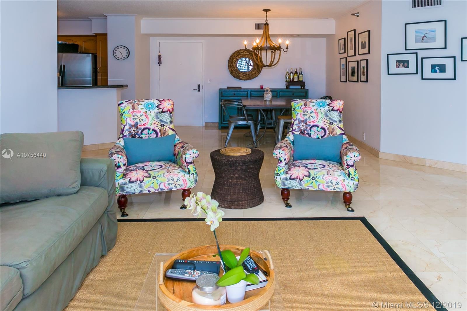 View from the window into the condo. Generous space with plenty of room for formal dining as well as open kitchen concept.