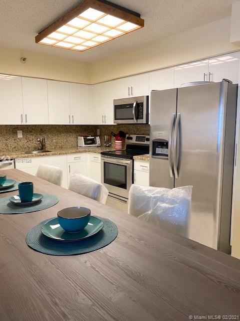 Photo of 3530 Mystic Pointe Dr #2607, Aventura, Florida, 33180 - Brand New Kitchen with counter and stools
