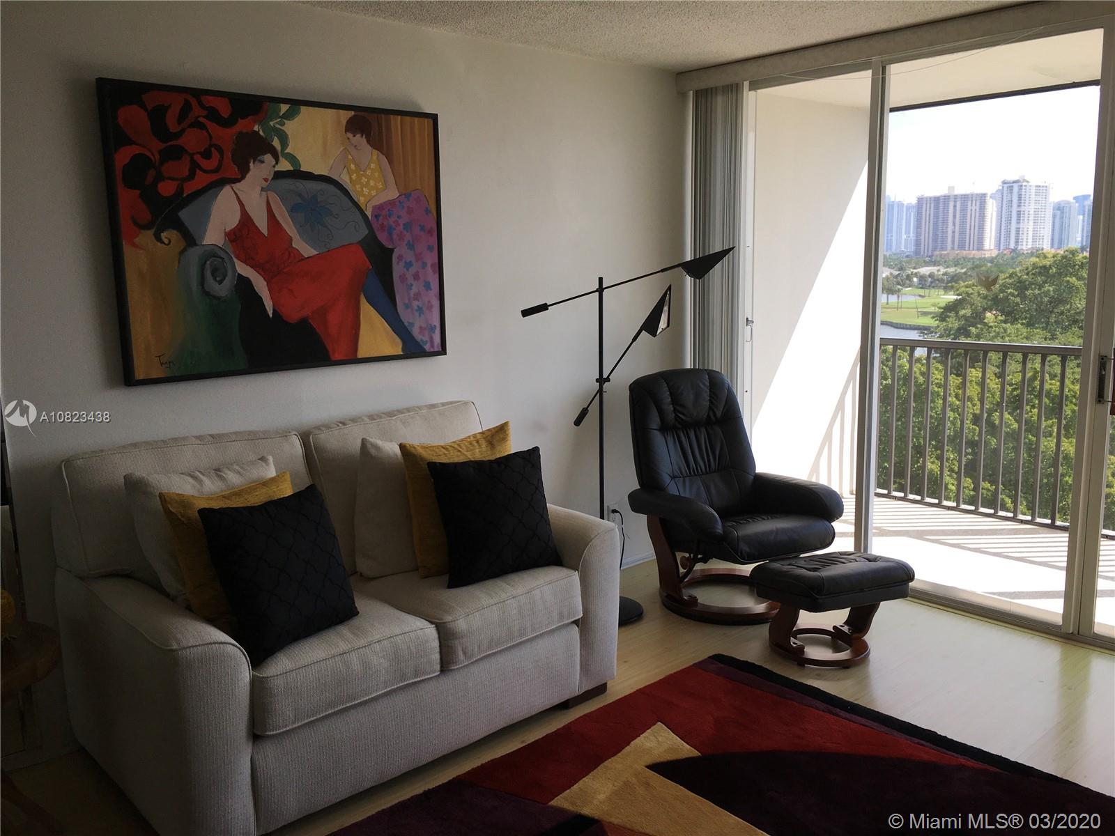 Photo of 3401 Country Club Dr #716, Aventura, Florida, 33180 - BEAUTIFULLY FURNISHED LIVING ROOM WITH GOLF COURSE VIEW