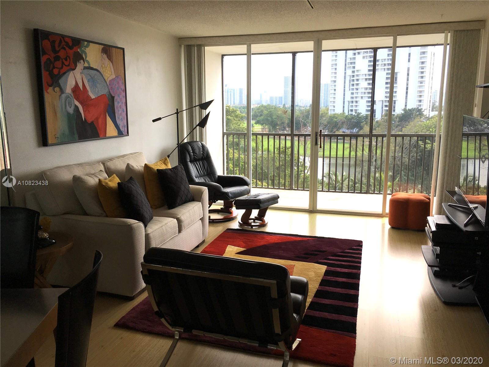 Photo of 3401 Country Club Dr #716, Aventura, Florida, 33180 - LIVING ROOM WITH DIRECT GOLF COURSE VIEW