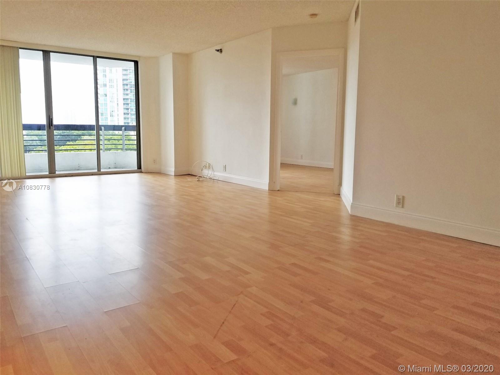 Photo of 3400 192 ST #503, Aventura, Florida, 33180 - New kitchen with new stainless steel appliances and glass tile backsplash.