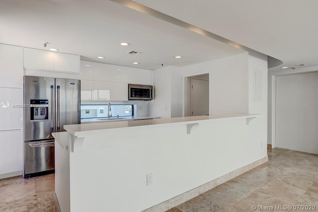 Photo of 425 Poinciana Island Drive #1444, Sunny Isles Beach, Florida, 33160 - View of kitchen with new s/s appliances and view to east terrace
