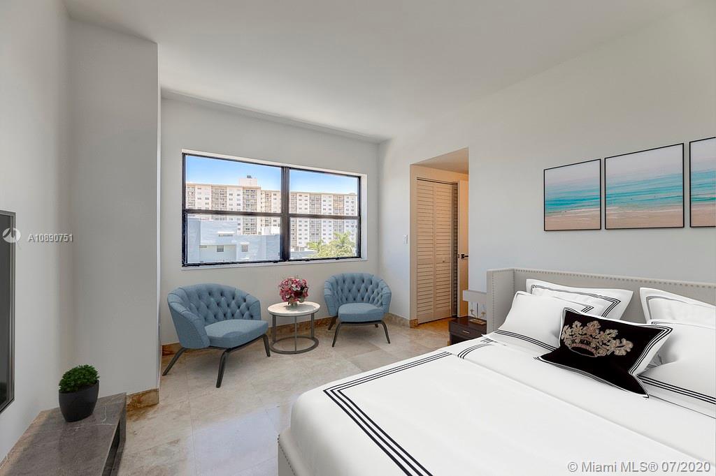Photo of 425 Poinciana Island Drive #1444, Sunny Isles Beach, Florida, 33160 - Bright and light primary bedroom with ceiling fan and views of terrace and Intercoastal waterway