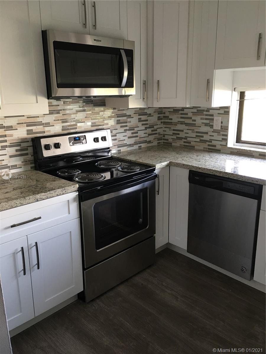 Photo of 17021 Bay Rd #501, Sunny Isles Beach, Florida, 33160 - Remodeled kitchen with stainless steel appliances and granite counter tops