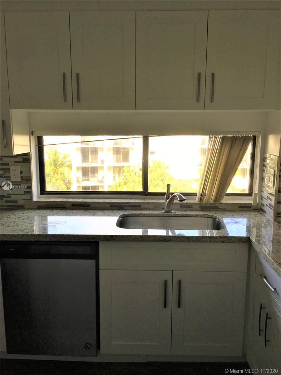 Photo of 17021 Bay Rd #501, Sunny Isles Beach, Florida, 33160 - Lady Susan in kitchen.