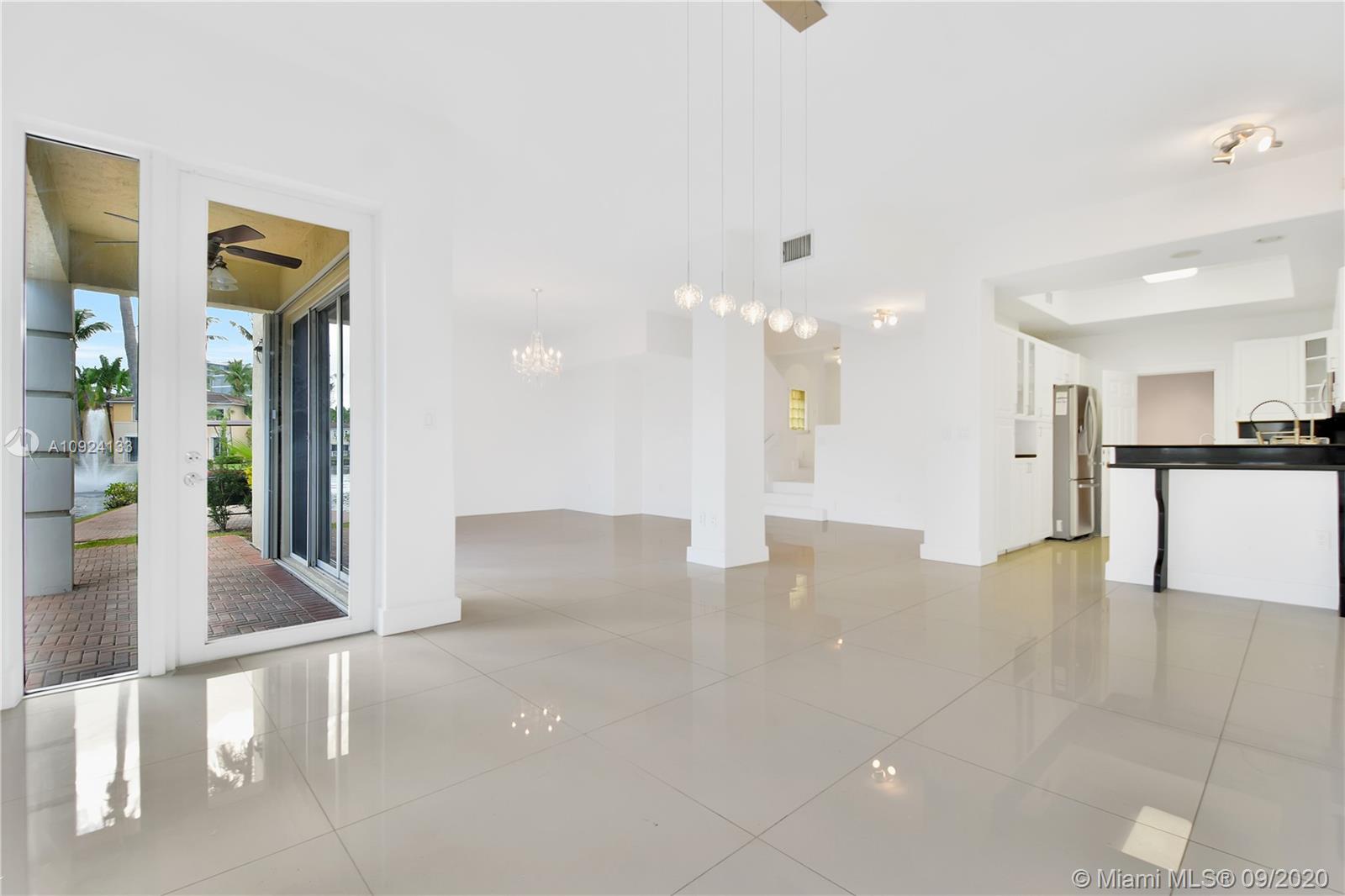 Photo of 20895 30th Pl, Aventura, Florida, 33180 - Living room area with lake views!!