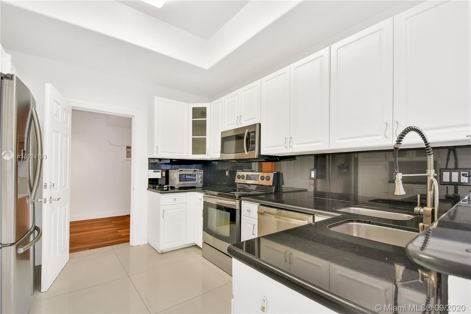 Photo of 20895 30th Pl, Aventura, Florida, 33180 - Dining room area and Living room area, very bright house! No carpets!!