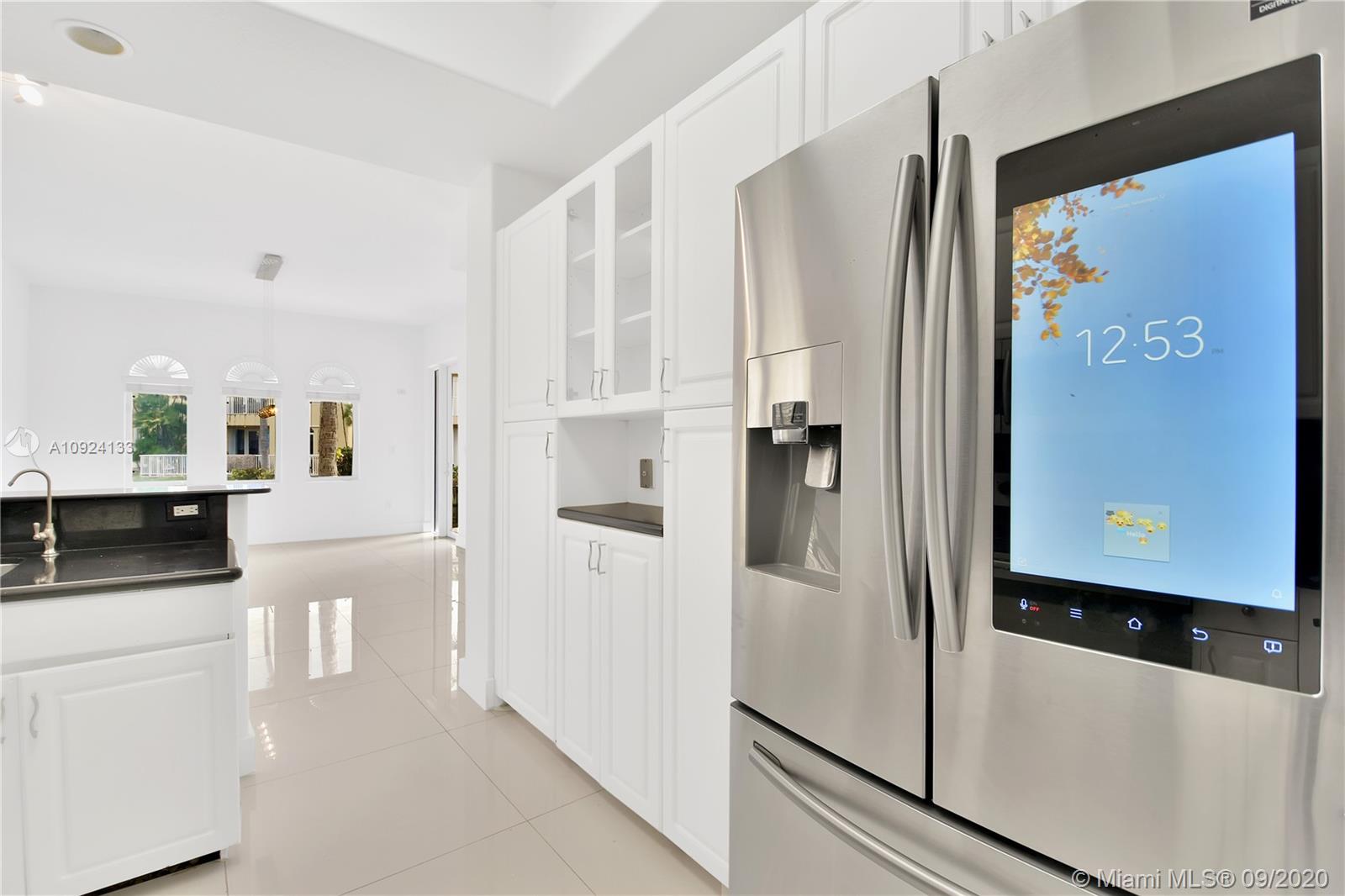 Photo of 20895 30th Pl, Aventura, Florida, 33180 - kitchen with brand new refrigerator and granite counter top