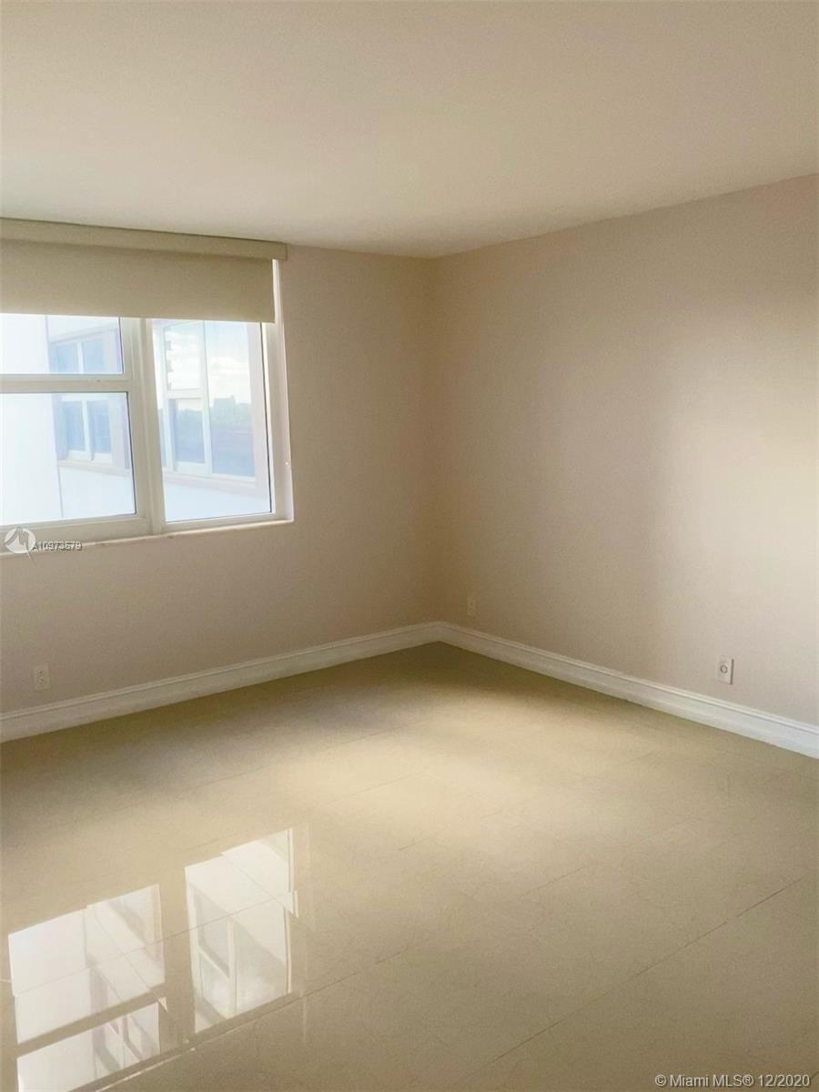 Photo of 2030 Ocean Dr #601, Hallandale Beach, Florida, 33009 - A renovated guest half-bath is just off the entrance foyer.