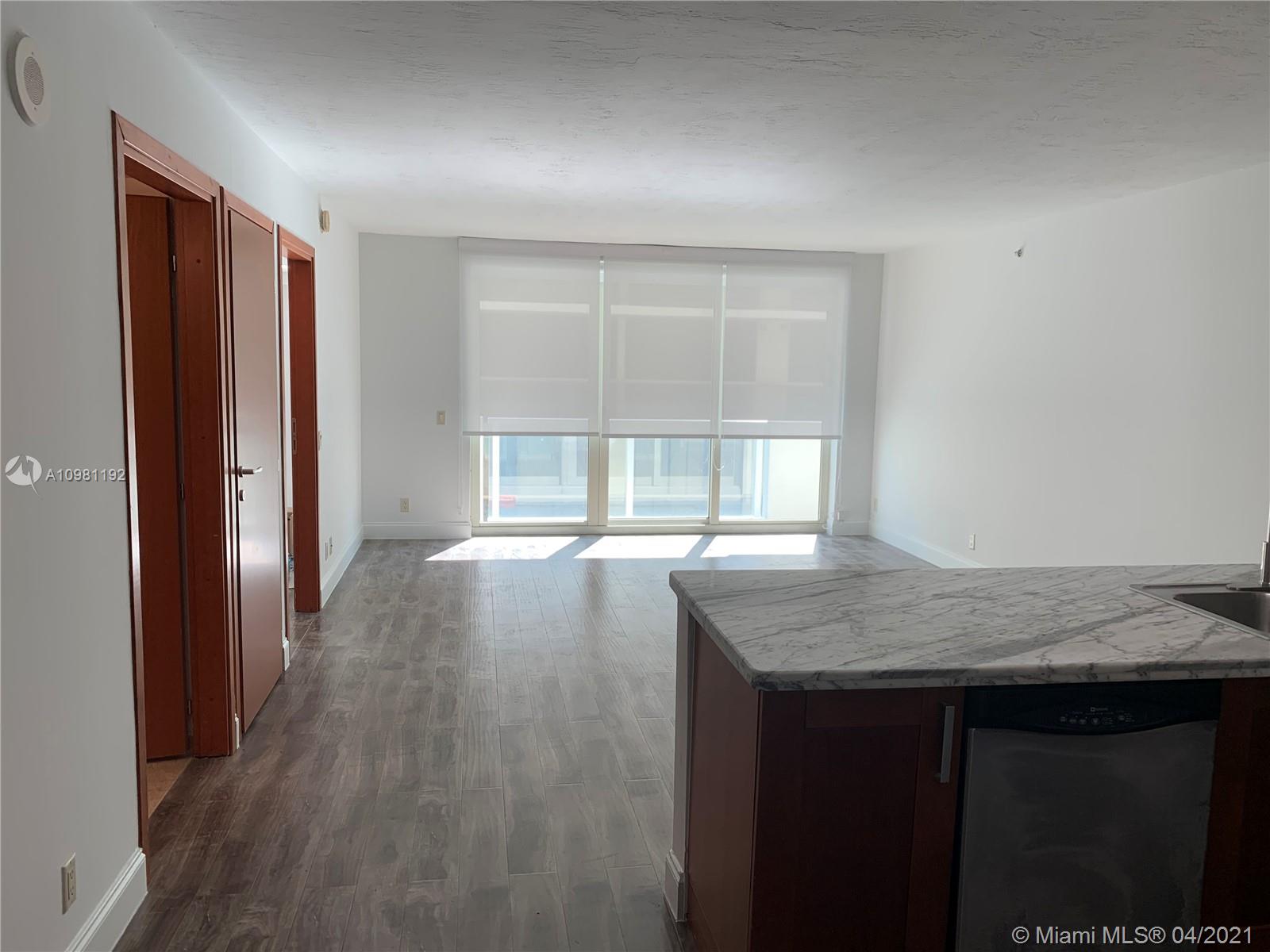 Photo of 9499 Collins Ave #1004, Surfside, Florida, 33154 - Living Room/Dining Room