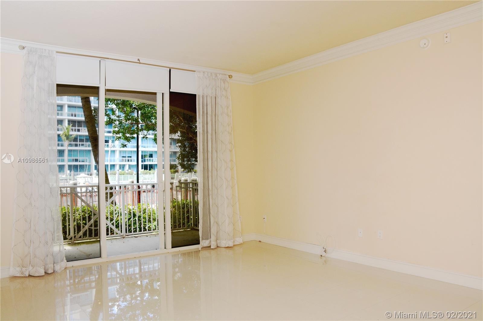Photo of 3001 185th St #103, Aventura, Florida, 33180 - Living Area and partial Guest Bedroom