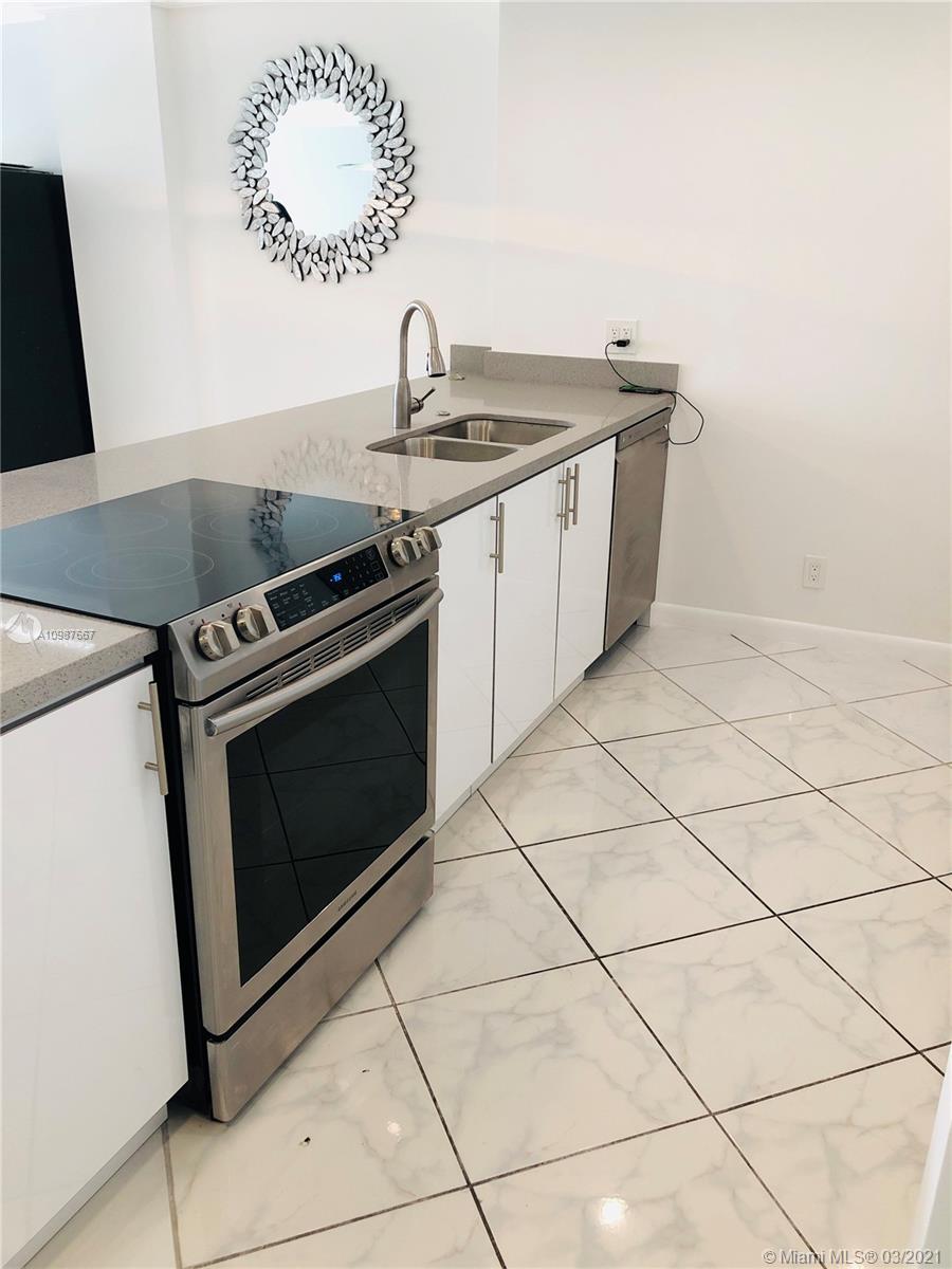 Photo of 3800 Ocean Dr #410, Hollywood, Florida, 33019 - BAR AREA/WITH WINE COOLER. ALL STAINLESS STEAL