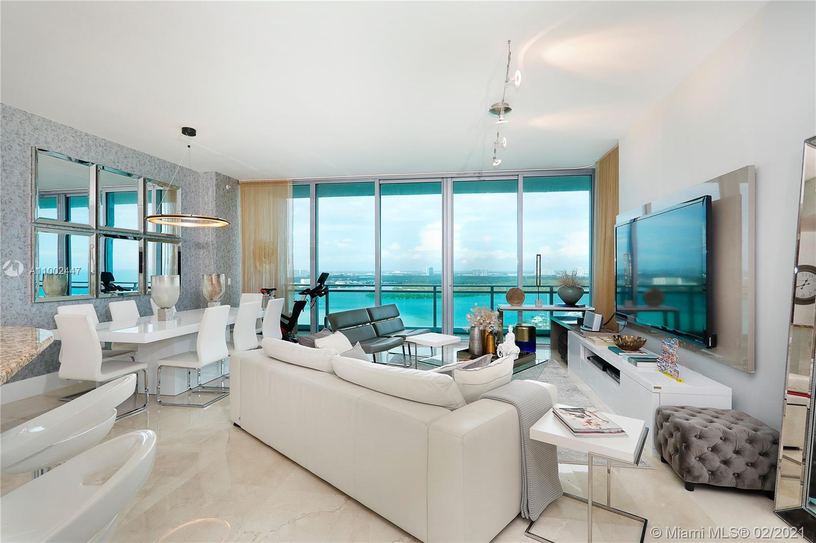 Living / Dining with gorgeous water views and balcony.