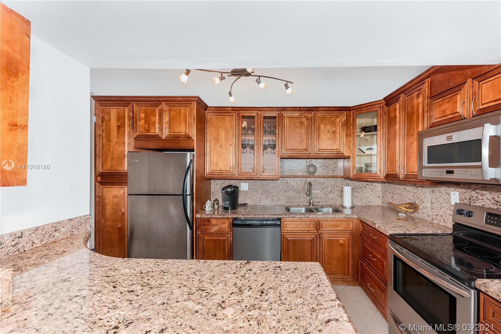 Photo of 1400 Ocean Dr #606, Hollywood, Florida, 33019 - Beautiful Kitchen with custom made wood cabinets and granite counters