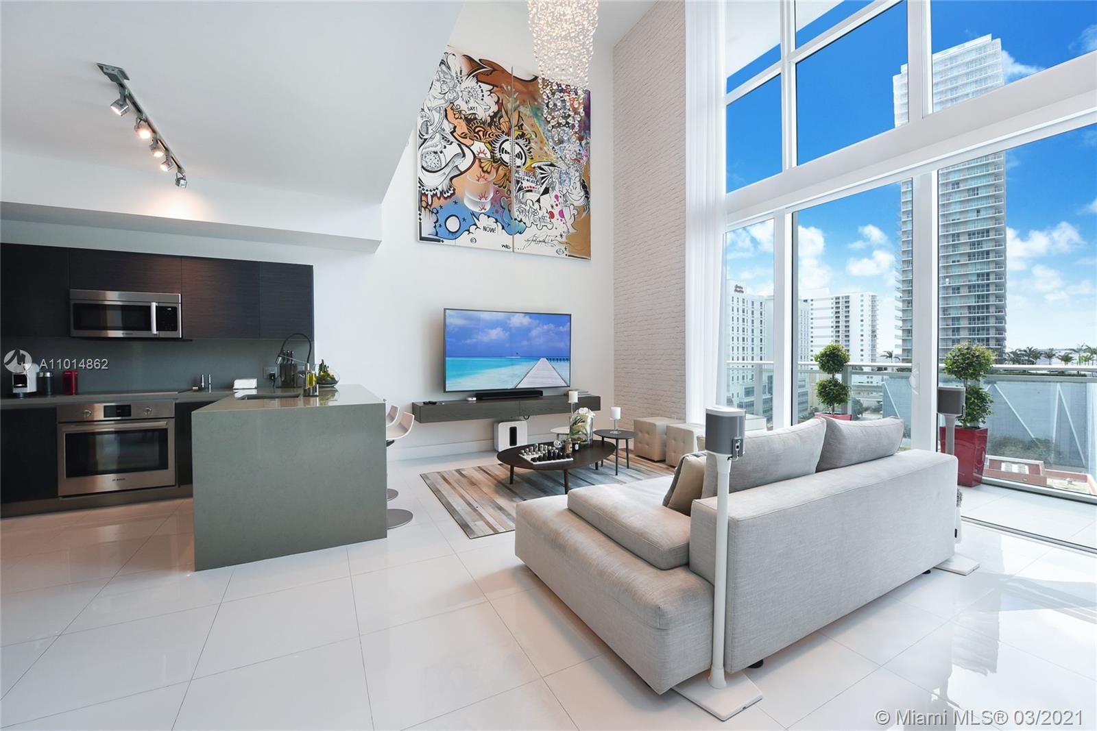Incredible light warms this unit with its voluminous wall of glass.