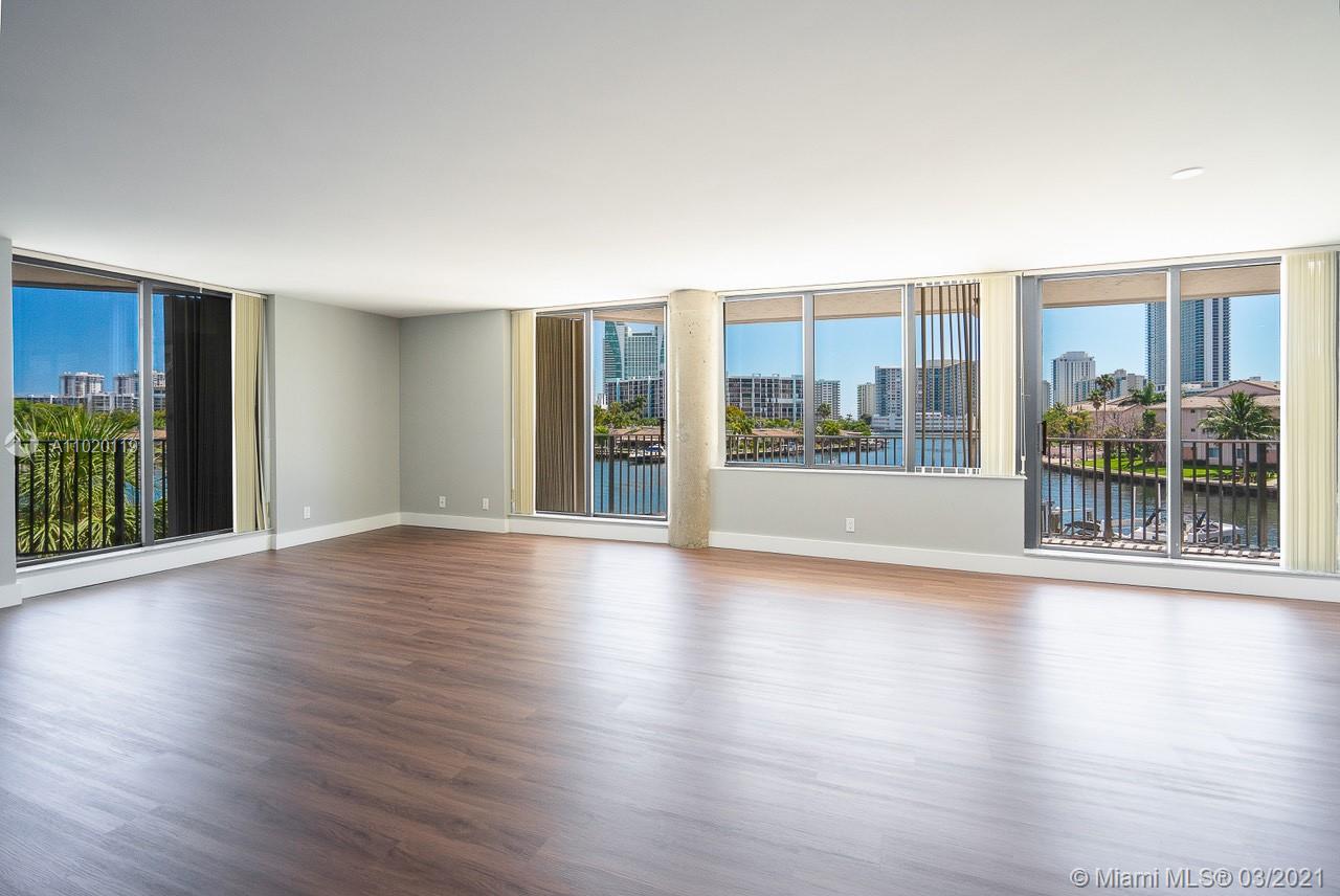 Floor to ceiling sliding doors surrounding the entire unit leading out to balcony