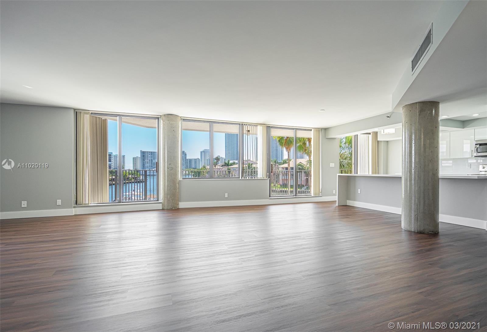 Photo of 300 Three Islands Blvd #602, Hallandale Beach, Florida, 33009 - Floor to ceiling sliding doors surrounding the entire unit leading out to balcony