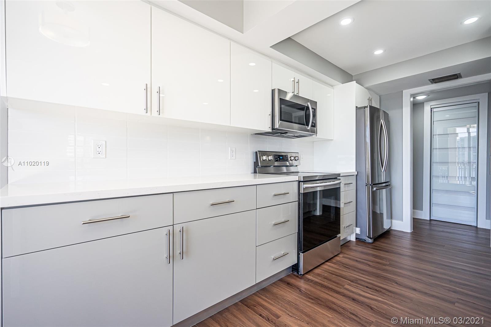 Photo of 300 Three Islands Blvd #602, Hallandale Beach, Florida, 33009 - Master bedroom with balcony access