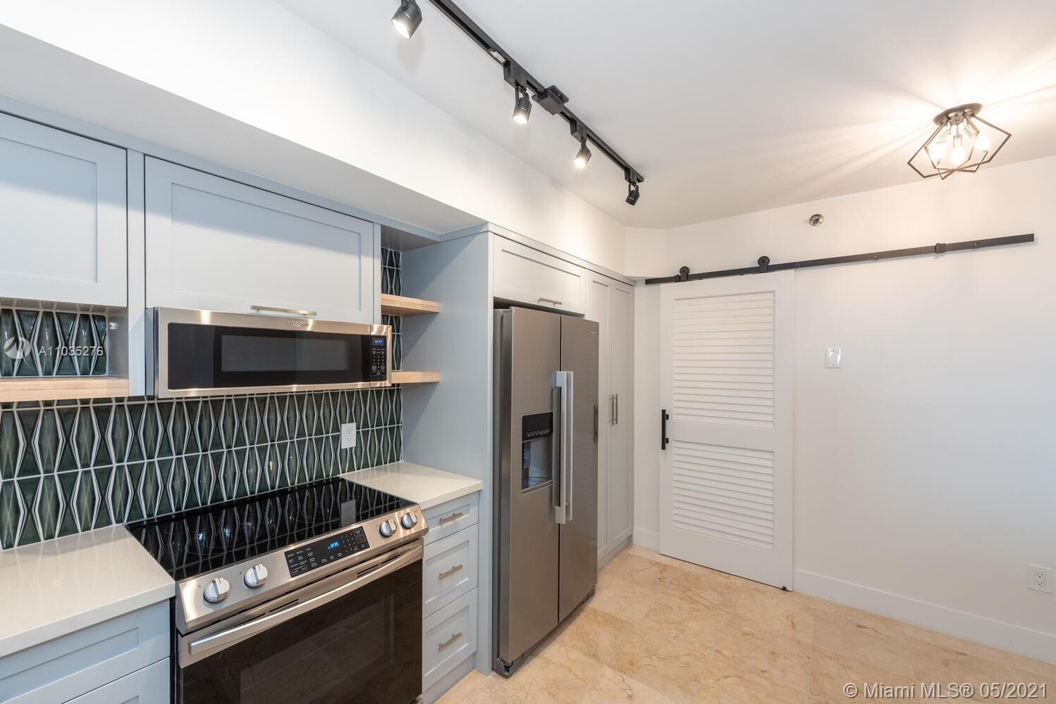 Photo of 8925 Collins Ave #4F, Surfside, Florida, 33154 - View from sliding glass doors to living/dining room and media room.