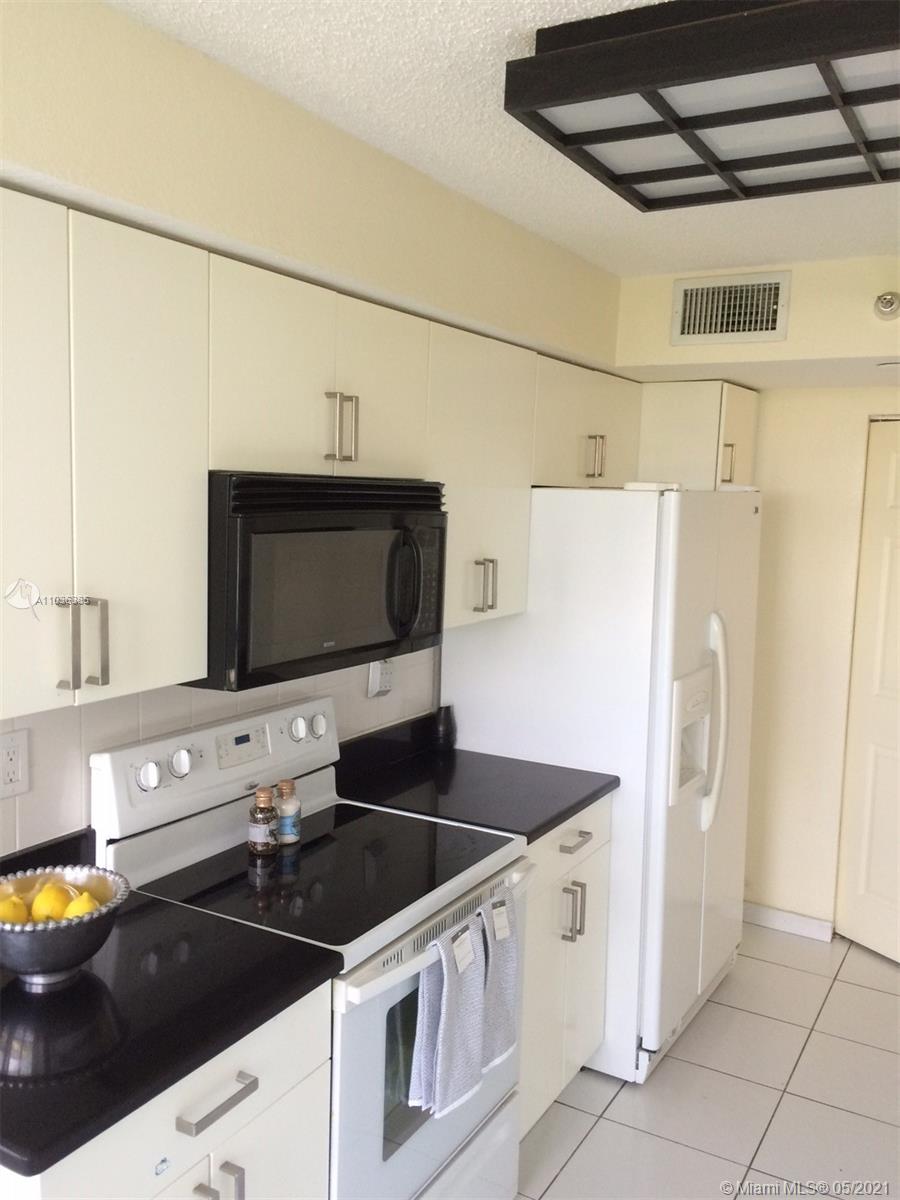 Photo of 3500 MYSTIC POINTE DR #904, Aventura, Florida, 33180 - Kitchen with breakfast area with lots of natural light