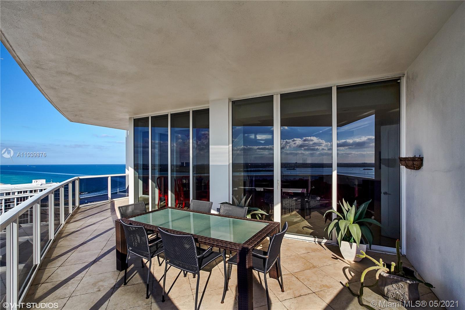Photo of 10225 Collins Ave #1703, Bal Harbour, Florida, 33154 - Expansive, sun-filled living and dining area.