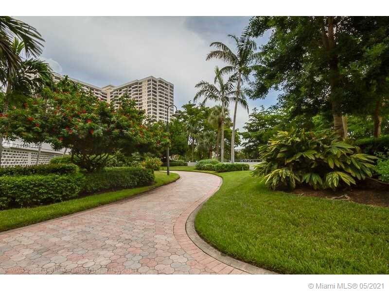 Photo of 500 Three Islands Blvd #410, Hallandale Beach, Florida, 33009 - Paved walkways surround this community's three towers.