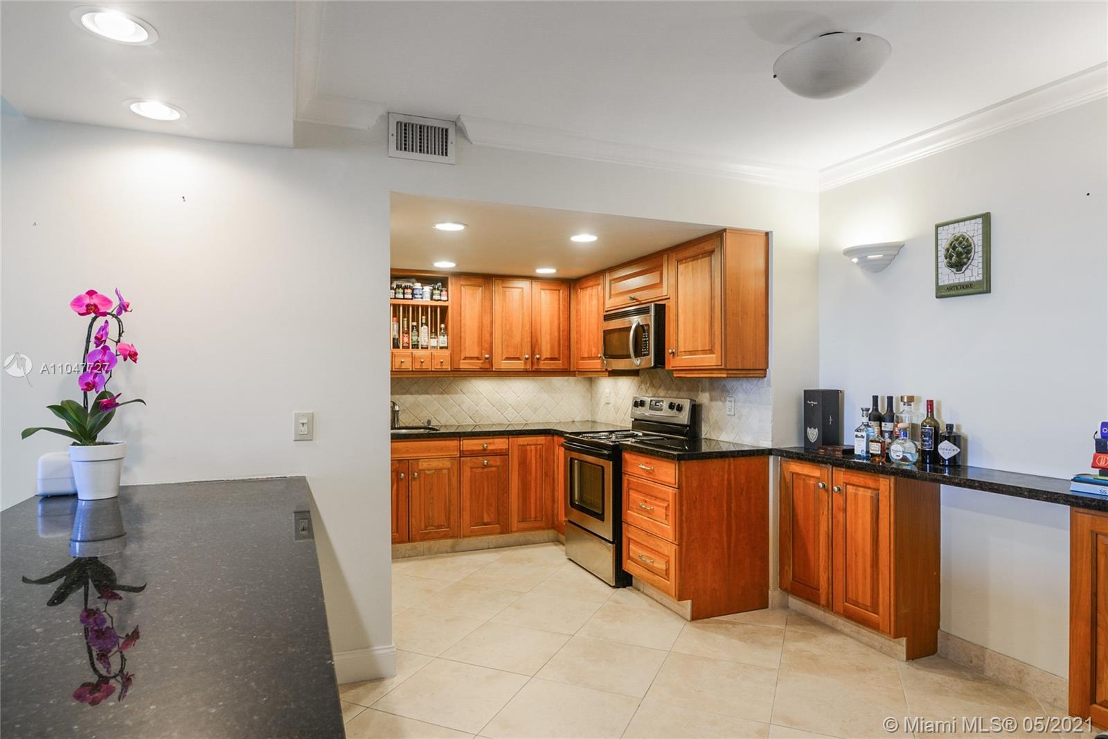 Photo of 9801 Collins Ave #14P, Bal Harbour, Florida, 33154 - Living-room, Open kitchen and entrance door.