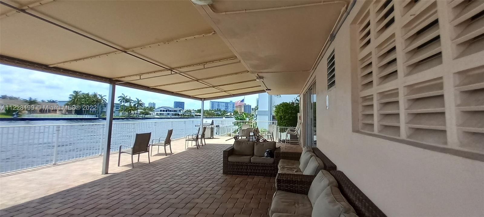 Photo of 3161 Ocean Dr #407, Hallandale Beach, Florida, 33009 - BBQ and Relaxation Area Looking towards the Intracoastal Waterway