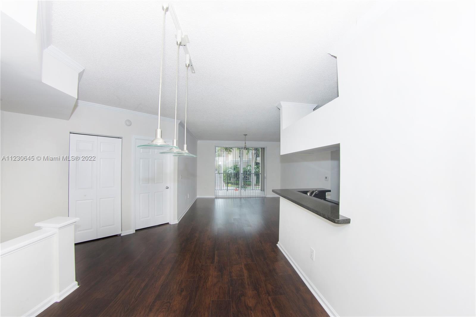 Photo of 17100 Bay Rd #1215, Sunny Isles Beach, Florida, 33160 - Living/ Dining Empty