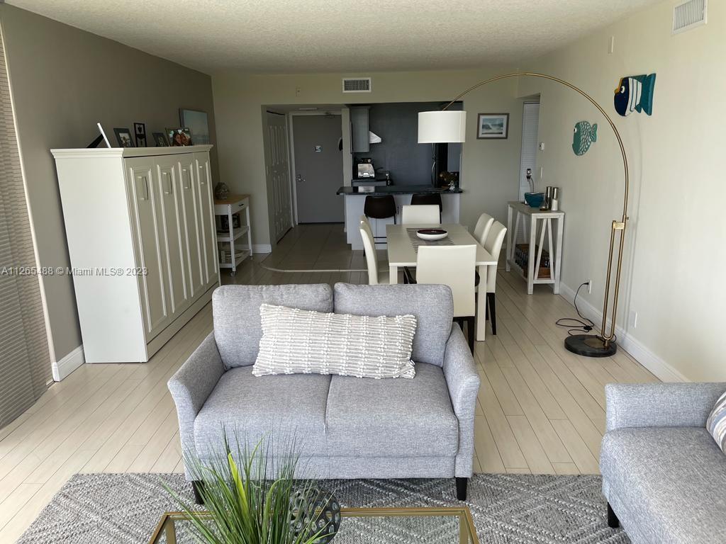 Photo of 20301 Country Club Dr #1623, Aventura, Florida, 33180 - view from living area towards entrance, kitchen and dinning