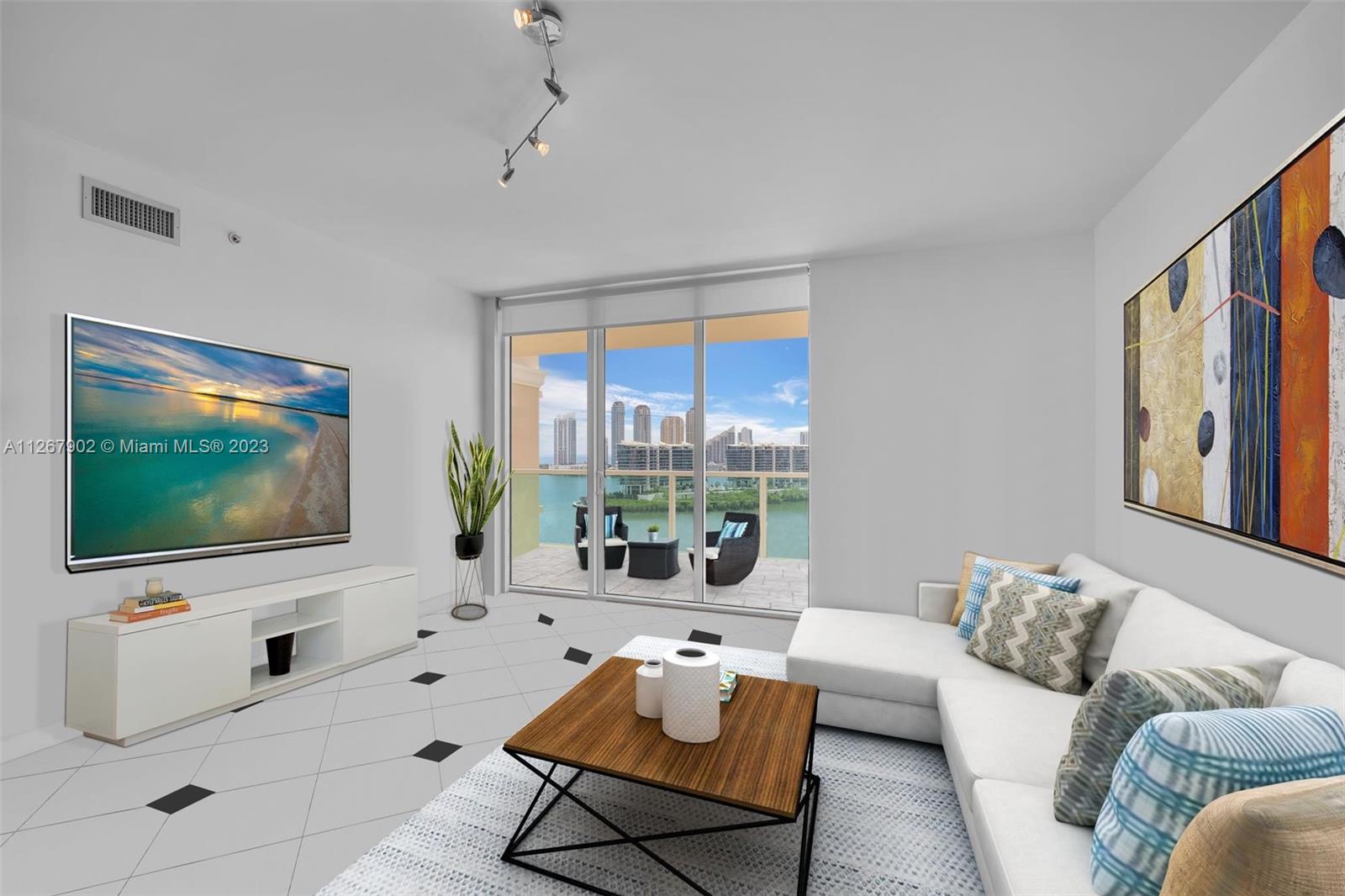 Photo of 3330 190th St #1716, Aventura, Florida, 33180 - Living room with amazing water views Photos virtually staged, with furniture