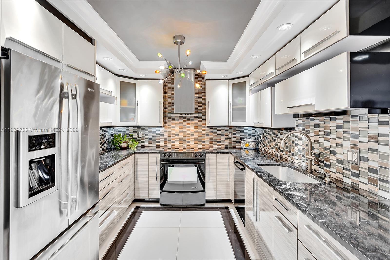 Photo of 1500 Ocean Dr #11A, Hollywood, Florida, 33019 - STATE OF THE ART CUSTOM KITCHEN W/JENN AIR APPLIANCES, GRANITE COUNTERS, AND BAR SEATING