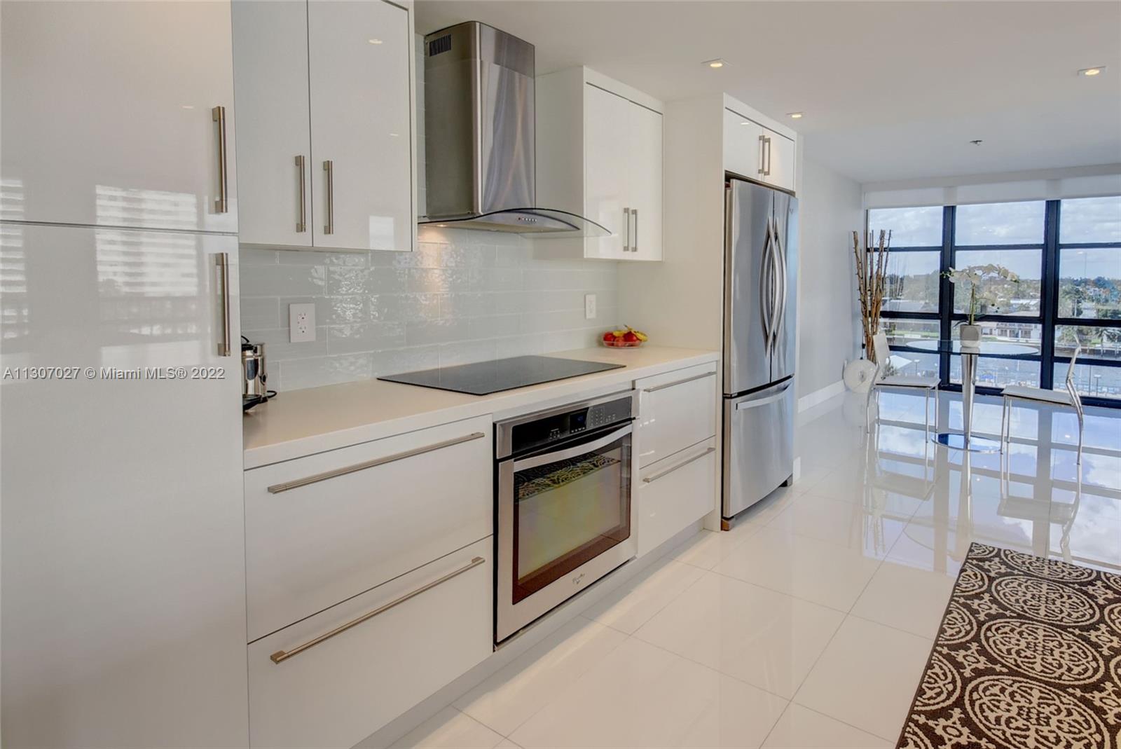 Photo of 2049 OCEAN DRIVE #702E, Hallandale Beach, Florida, 33009 - Modern open concept Kitchen with beautiful water & sunset views