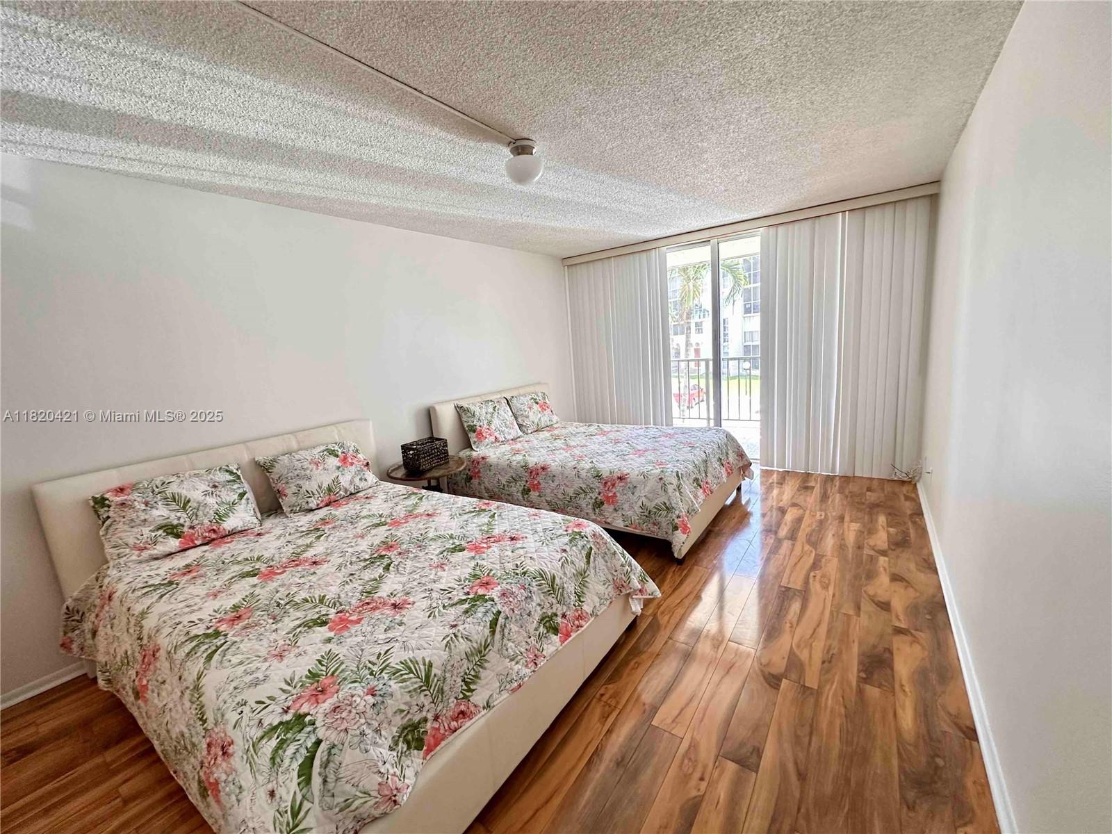 Photo of 601 Three Islands Blvd  #210, Hallandale Beach, Florida, 33009 - Your new sanctuary to sleep and relax. Spacious bedroom with direct access to the balcony.601 Three Islands Blvd., Unit #210, Three Islands, Hallandale Beach, FL. Available For Rent.