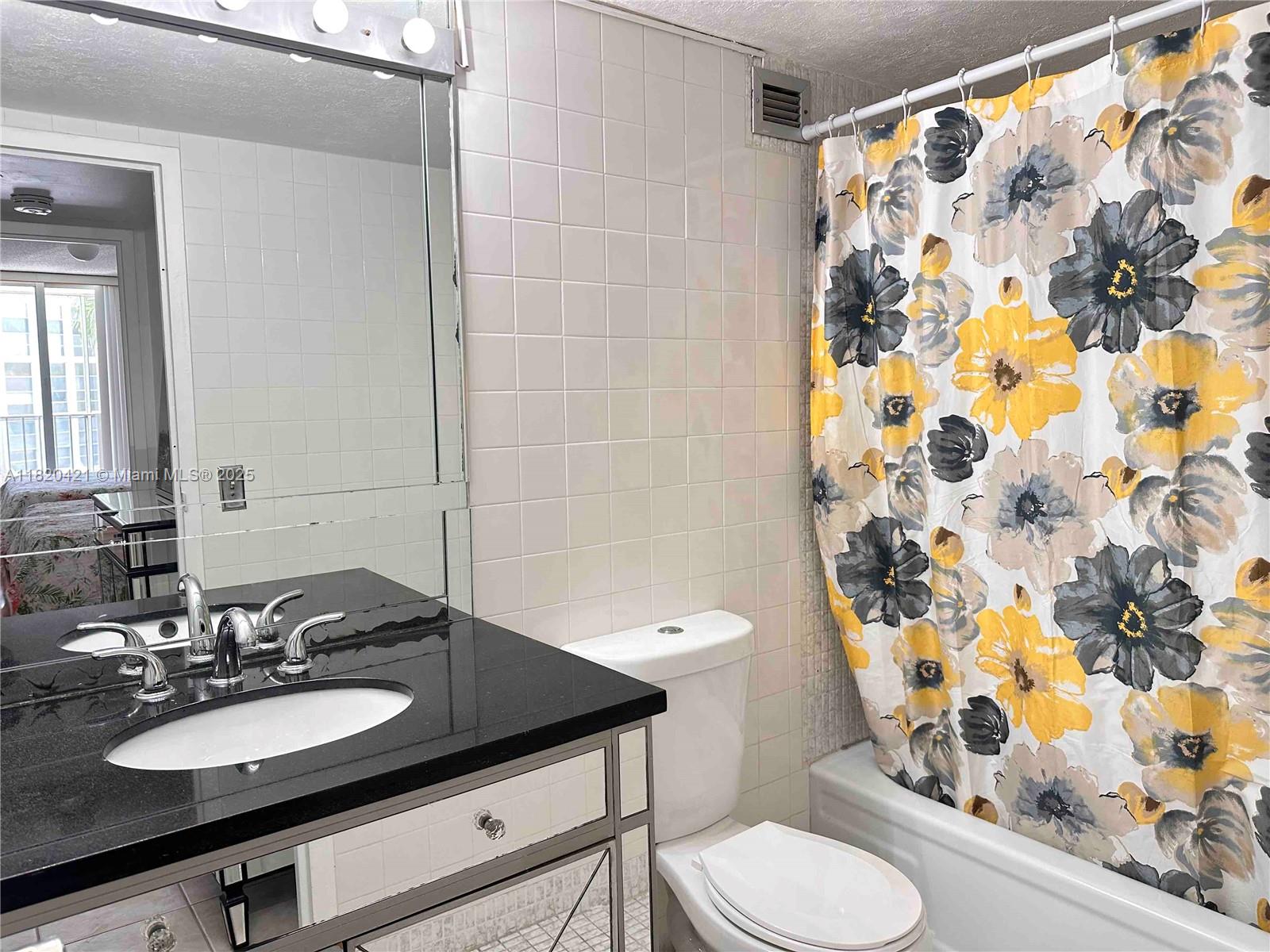 Photo of 601 Three Islands Blvd  #210, Hallandale Beach, Florida, 33009 - Updated bathroom with shower/tub combination.601 Three Islands Blvd., Unit #210, Three Islands, Hallandale Beach, FL. Available For Rent.