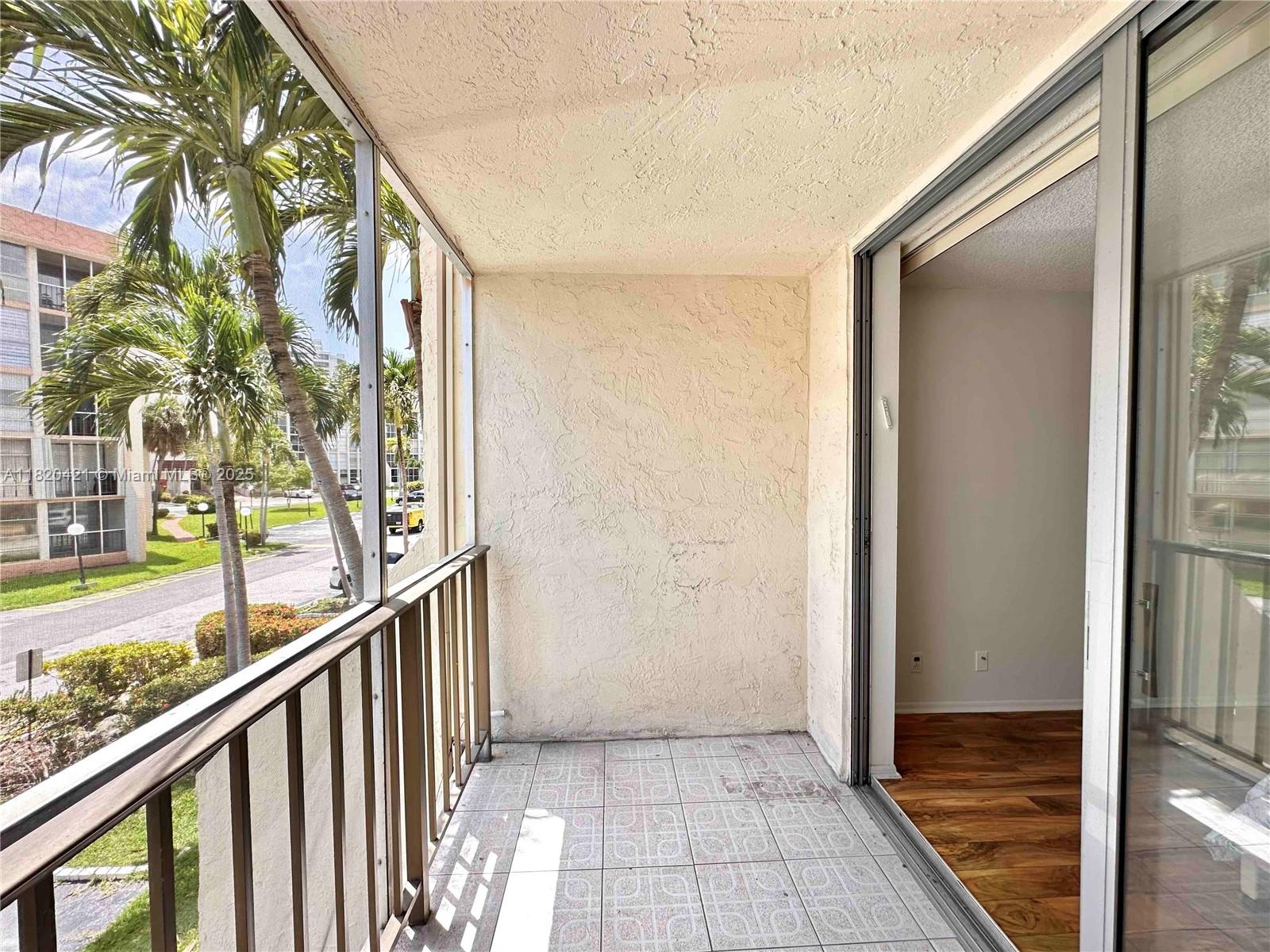 Photo of 601 Three Islands Blvd  #210, Hallandale Beach, Florida, 33009 - Spacious balcony overlooking the community. Direct access from the bedroom.601 Three Islands Blvd., Unit #210, Three Islands, Hallandale Beach, FL. Available For Rent.